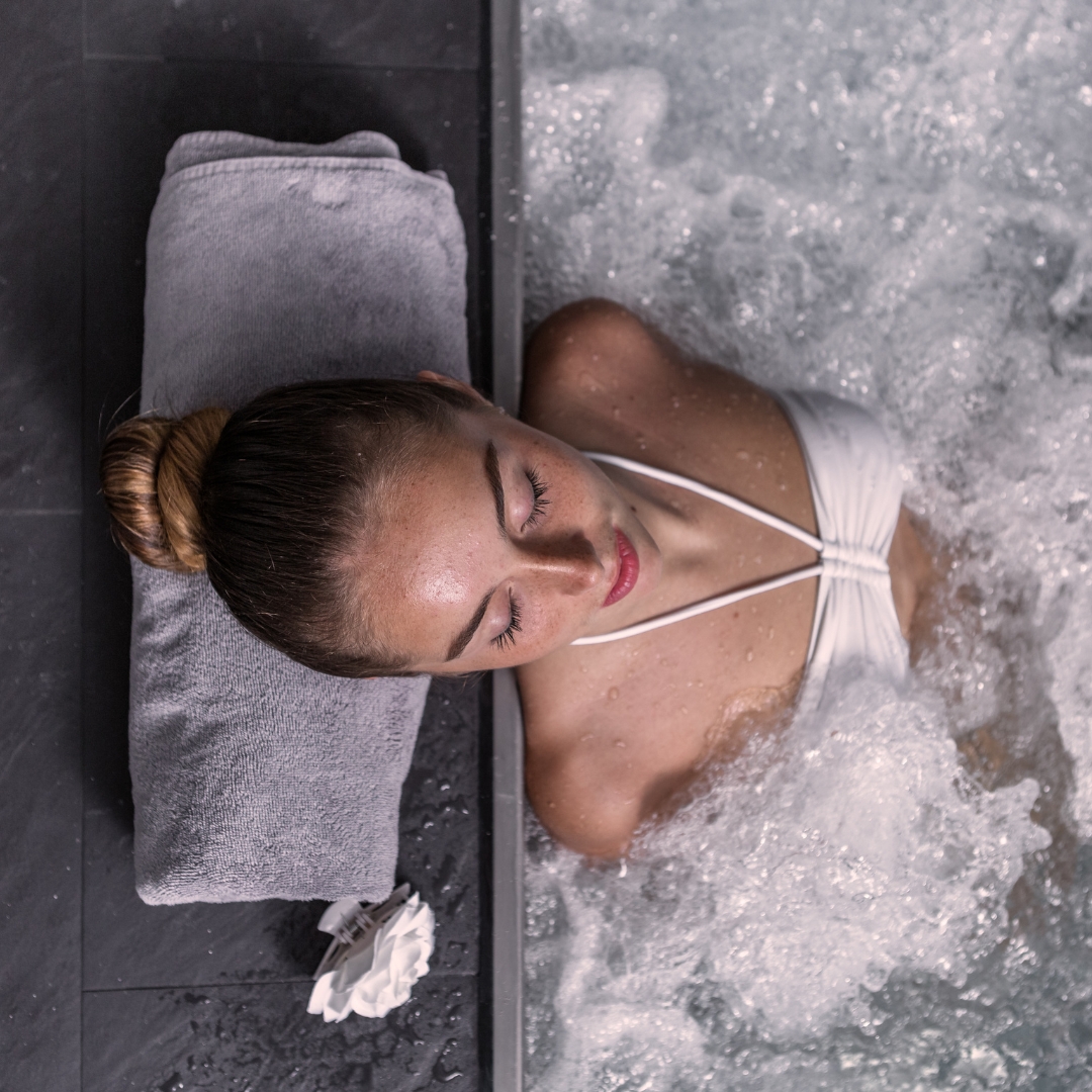 woman relaxing in hot tub